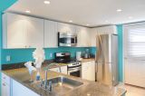 A Modern Kitchen With Stainless Steel Appliances